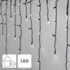 A close-up view of a string of LED lights hanging vertically against a white wall. Podgląd zdjęcia produktu