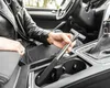 A person is holding a telescopic side mirror wiper inside a car. Anteprima dell’immagine prodotto