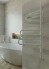 A modern bathroom with a freestanding bathtub and a white towel warmer. Náhľad obrázku produktu