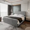 A modern bedroom with a large upholstered bed as the focal point. Produktbild-Vorschau