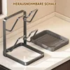 A kitchen organizer for pot lids and cutting boards sits on a countertop. Produktbild-Vorschau