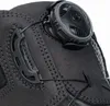 A close-up view of a black safety boot's lacing system. Produktbild-Vorschau