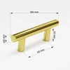 A golden cabinet handle with measurement lines and dimensions shown. Podgląd zdjęcia produktu