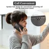 A woman is holding a phone case to her ear, simulating a phone call. Produktbild-Vorschau