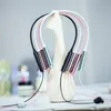 Several pairs of in-ear headphones are displayed on a white stand. Produktbild-Vorschau