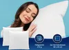 A woman is sleeping on a large pillow, with two smaller pillows in the foreground. There are circular icons with text below them. Produktbild-Vorschau