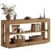 A wooden console table with decorative items on it, including a vase of flowers, books, and baskets. Produktbild-Vorschau