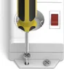 A close-up view of a screwdriver being used to tighten a screw on a white power strip. Produktbild-Vorschau