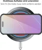 A smartphone with a case is placed on a wireless charger. Produktbild-Vorschau