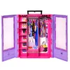 A toy closet playset for dolls, open and displaying various clothing and accessories. Anteprima dell’immagine prodotto
