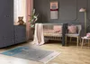A nursery room with a crib, dresser, chair, and rug. Náhled obrázku produktu