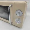 A close-up view of the side of a beige retro-style microwave oven. Produktbild-Vorschau