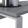 Close-up of a modern desk with a concrete-like tabletop and white metal legs. A silver thermos and a white mug are visible on the tabletop. Produktbild-Vorschau