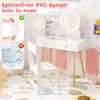 A child's vanity set with a mirror, chair, and accessories, set in a decorated room. Podgląd zdjęcia produktu