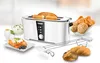 A white 4-slice toaster with bread inside, along with a bowl of rolls, toast with toppings, and an egg cup. Produktbild-Vorschau
