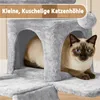 A Siamese cat is resting inside a grey cat tree. Produktbild-Vorschau