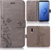 Collage of images showing a grey flip phone case with a floral pattern, a Samsung Galaxy S9 Plus phone, and the phone inside the case. Produktbild-Vorschau