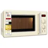 A cream-colored retro microwave oven is shown against a white background. There are several quality award stickers on the left side of the product. Produktbild-Vorschau