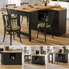 A collage of images showing a black extendable bar table with a wooden top, set in a kitchen or dining area. The table is shown in different configurations and angles, with chairs around it. Produktbild-Vorschau