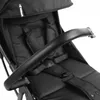 Close-up of a stroller's handle and seat. Náhľad obrázku produktu