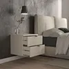 A modern bedroom scene with a wall-mounted nightstand next to a bed. Produktbild-Vorschau