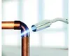 A propane torch is being used to solder copper pipes. Produktbild-Vorschau