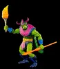 A green, reptilian-like action figure with purple horns and armor, holding a torch in one hand and a spear in the other, against a black background. Náhled obrázku produktu
