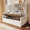A white wooden daybed with an open storage compartment and a built-in bookshelf unit above. Náhled obrázku produktu