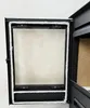 Close-up view of a stove door with a glass window and white rope seal. Náhled obrázku produktu