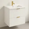 A white wall-mounted bathroom vanity with a sink and a gold faucet. Podgląd zdjęcia produktu