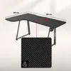 A black L-shaped desk with dimensions and a close-up of its carbon fiber texture is shown against a light background. Podgląd zdjęcia produktu