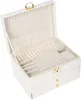 An open white jewelry box with multiple compartments and drawers. Podgląd zdjęcia produktu