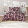 A bedroom scene with a bed dressed in paisley patterned bedding. Produktbild-Vorschau