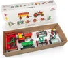 A toy farm set with a tractor and various agricultural implements laid out in a cardboard box. Náhled obrázku produktu