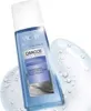 A bottle of Vichy Dercos Mineral Soft & Fortifying Shampoo is shown on a white background with water droplets. Voir les images du produit