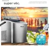 An ice maker is shown with drinks in the background, set against a beach scene with people and a sunset. Náhled obrázku produktu