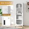 A tall, narrow white cabinet with glass doors is shown in a room. Insets highlight safety features. Podgląd zdjęcia produktu