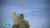 A scene from the video game Worms Battlegrounds, showing worms on a rocky terrain with bombs falling from the sky. Náhled obrázku produktu