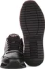 A black Reebok shoe is shown next to its sole. Voir les images du produit