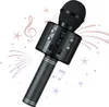 A black wireless karaoke microphone with decorative musical notes and stars in the background. Produktbild-Vorschau
