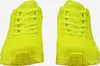 A pair of bright yellow Skechers sports shoes are shown from a front-facing perspective against a white background. Anteprima dell’immagine prodotto