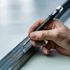A hand is using a Pica Fine-Dry marker to draw a line on a metal bar. Anteprima dell’immagine prodotto