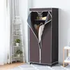 A portable wardrobe with clothes inside, placed next to a corner shelf with plants and decor. Podgląd zdjęcia produktu