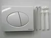 A white toilet flush plate with two buttons and mounting hardware on a white background. Anteprima dell’immagine prodotto
