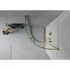 A modern bathroom with a curved glass shower enclosure and gold fixtures. Podgląd zdjęcia produktu