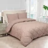 A bed with a taupe comforter and pillows in a bedroom setting. Produktbild-Vorschau