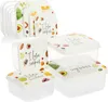 A set of clear plastic food storage containers with decorative lids, arranged in a group. Produktbild-Vorschau