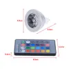 A product shot showing an LED light bulb and a remote control with dimensions indicated by red lines and text. Voir les images du produit