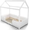 A white wooden children's bed with a house frame and a low fence-like railing around the mattress area. Náhled obrázku produktu
