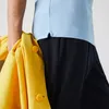 Polo azzurro Lacoste Classic Fit Anteprima dell’immagine prodotto 27